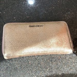 Jimmy Choo Gold Metallic wallet with a zipper